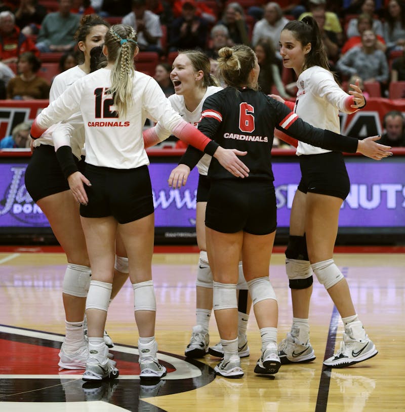 The Ball State Women's Volleyball team celebrates scoring a point in a game against Kent State Nov. 4 at Worthen Arena. Ball State earned MAC West Champions after sweeping Kent in their 13th straight win. Amber Pietz, DN