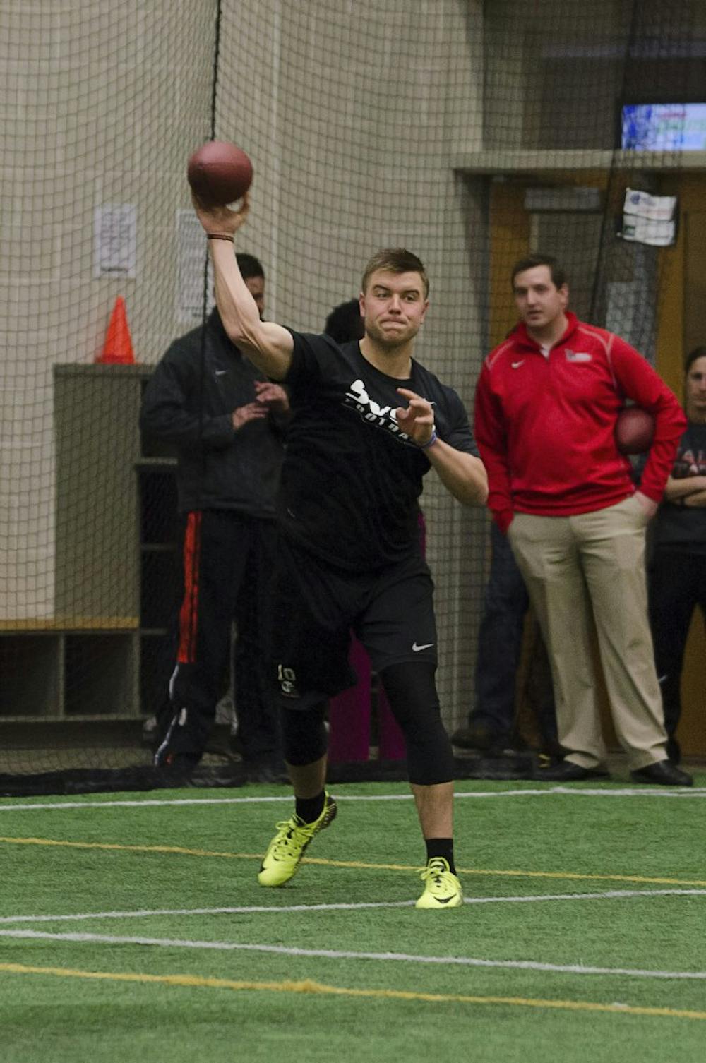 Keith Wenning throws a football as part of the drills for wide receivers on March 27 at Pro Day at the Student Recreational Center. DN PHOTO BREANNA DAUGHERTY 