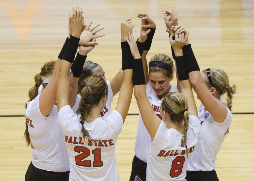 The women's volleyball team huddles up before a set in the second game of the Active Ankle Tournament against Belmont on Aug. 28 at Worthen Arena. DN PHOTO BREANNA DAUGHERTY