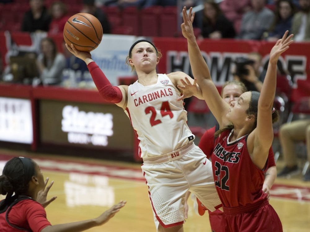 Junior guard Jasmin Samz attempts a shot while being guarded by Northern Illinois’ Errin Hodges, left, and Abby Woollacott during the Cardinals’ game against the Huskies Jan. 27 in John E. Worthen Arena. Eric Pritchett, DN File