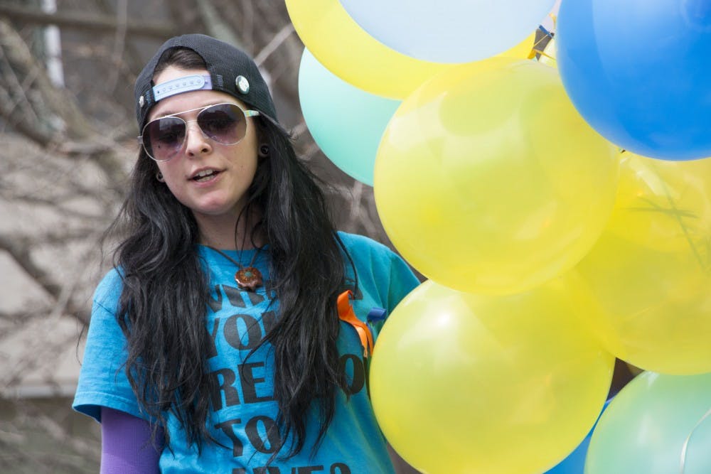 Carmen Diaz, a senior social work major, speaks during the Out of the Darkness Walk on April 6. The walk was a part of the Alive Campaign. DN PHOTO TAYLOR IRBY