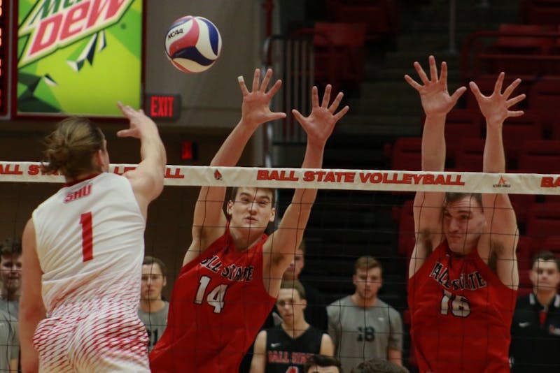 Ball State sophomore Matt Szews and senior Matt Walsh just to block a spiked ball from Sacred Heart during the game against on Jan. 19. The Cardinals won 3-2. Carlee Ellison, DN