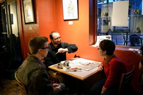 Artist Brandon Beeson talks to his subject as he works on his drawing Oct. 2012. PHOTO COURTESY OF LISA DEGLER
