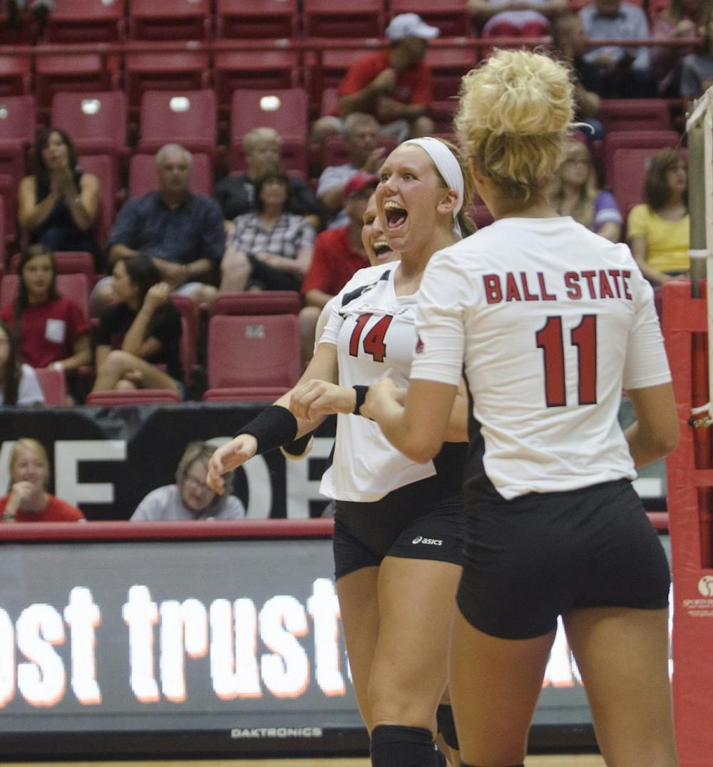 Redshirt middle blocker junior Kelly Hopkins celebrates after a play in the match against Western Illinois on Aug. 29 at Worthen Arena. DN PHOTO BREANNA DAUGHERTY