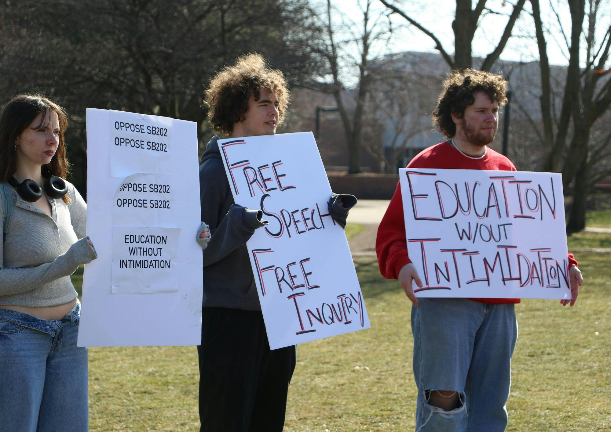 Protesters hold signs related to opposition of Indiana Senate Bill (SB) 202 Feb. 22 on University Green. The protest, hosted by the Young Democratic Socialists of America, opposed SB 202. Olivia Ground, DN