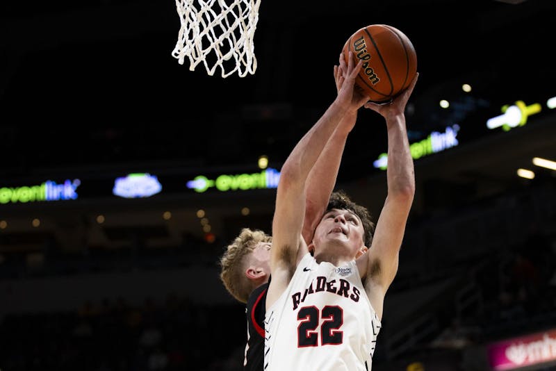 Sophomore guard Camden Bell goes for a basket against Brownstown Central March 30 at IHSAA State Finals at Gainbridge Fieldhouse in Indianapolis. Bell was 1-7 on field goal attempts. Amber Pietz, DN