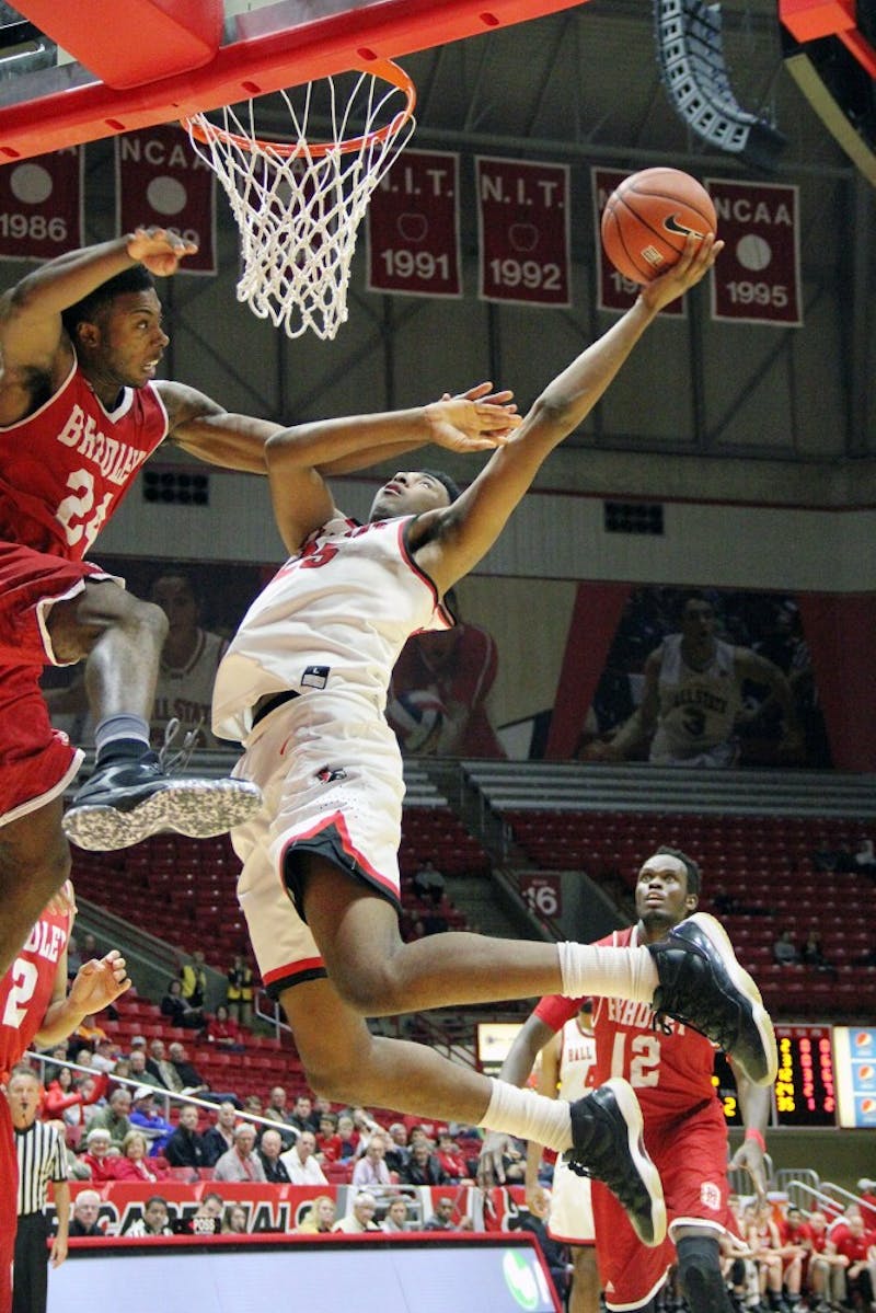 Forward Tahjai Teague goes up for a shot and is defended by Bradley’s Jojo McGlaston during the Cardinals’ game against the Braves in 2016 in Worthen Arena. Ball State will host Saint Francis for an exhibition game on Nov. 6. Paige Grider, DN File