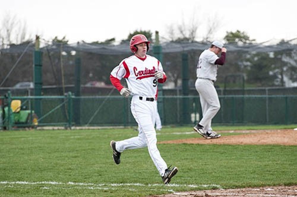 Junior Sean Godfrey runs to first base during a game against Central Michigan April 12. Ball State will be playing a series against Ohio this weekend. DN FILE PHOTO BOBBY ELLIS
