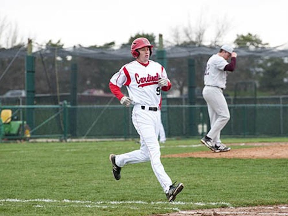 Junior Sean Godfrey runs to first base during a game against Central Michigan April 12. Ball State will be playing a series against Ohio this weekend. DN FILE PHOTO BOBBY ELLIS
