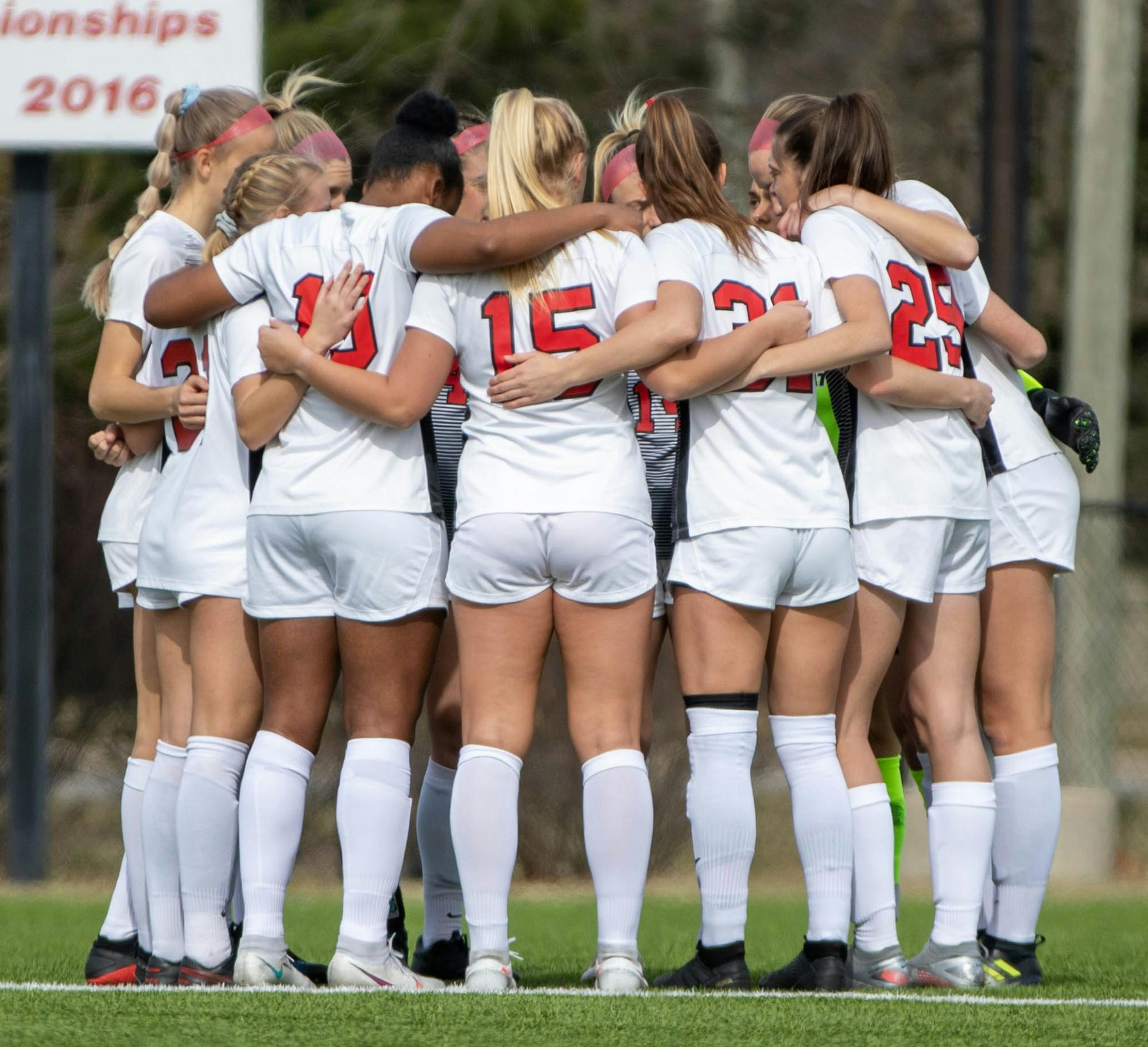 The Ball State Soccer team huddles up before the game March 12, 2021, at Briner Sports Complex. The Cardinals tied at zero in double overtime against the Broncos. Jaden Whiteman, DN