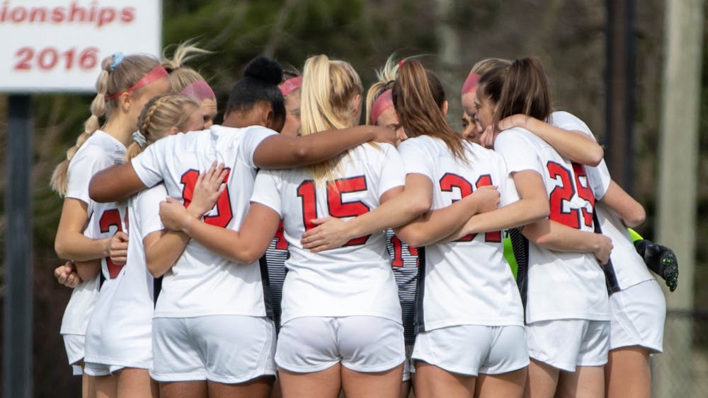 The Ball State Soccer team huddles up before the game March 12, 2021, at Briner Sports Complex. The Cardinals tied at zero in double overtime against the Broncos. Jaden Whiteman, DN