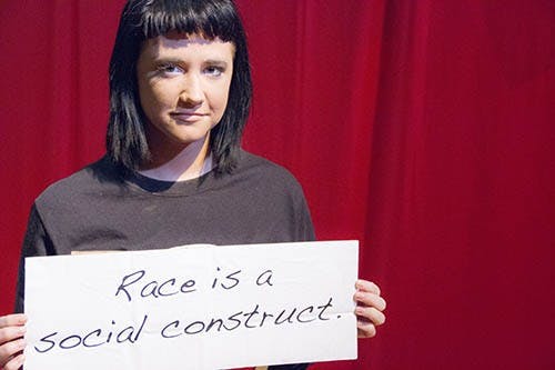 Sophomore public relations major holds a sign to bring attention to the racism that still lingers in society today during the Tunnel of Oppression Wednesday evening in the L.A. Pittenger Student Center. DN PHOTO EMMA FLYNN
