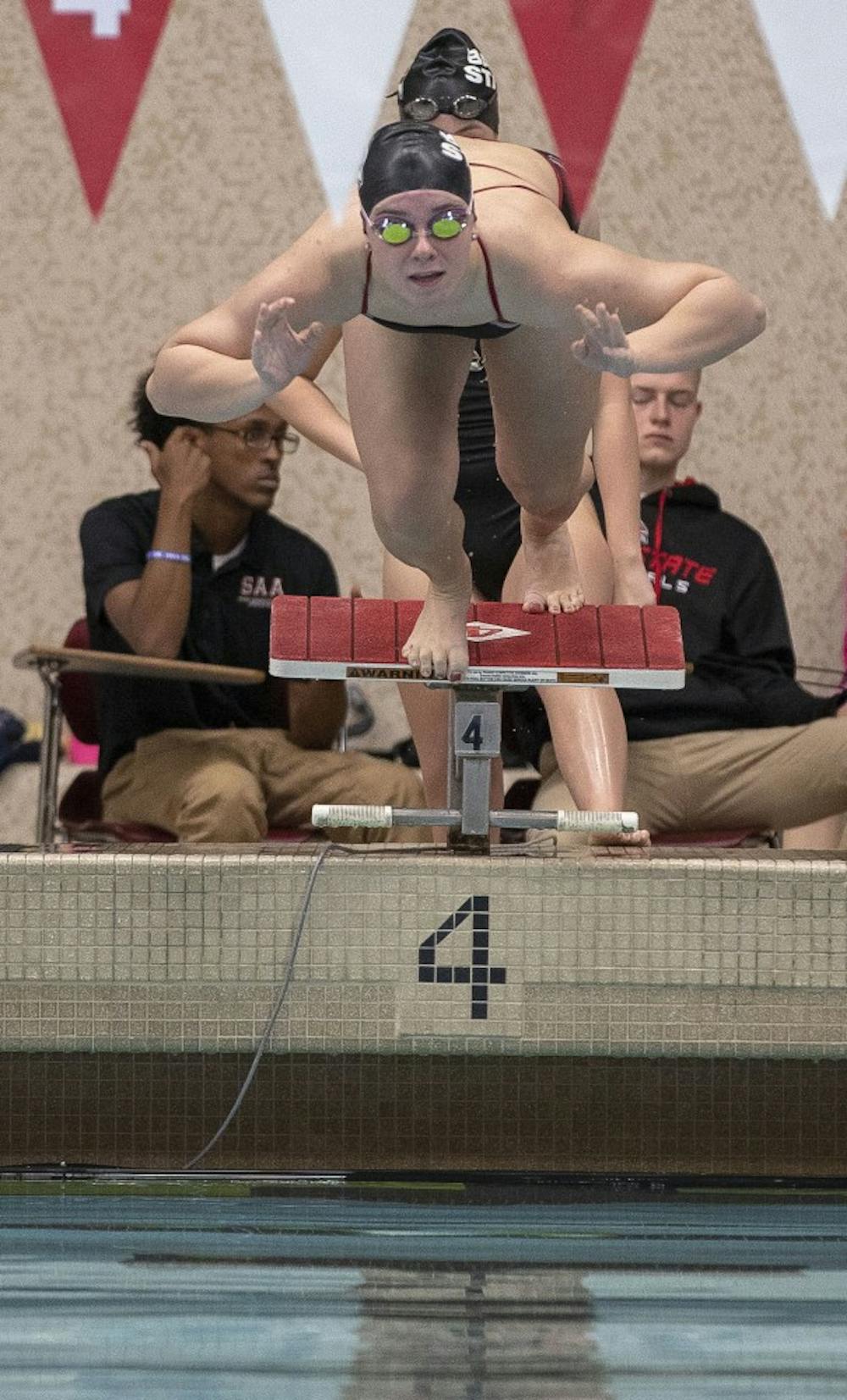 <p>A Ball State swimmer launches off the starting block at the women's swim meet Saturday Nov. 3, at Lewellen Aquatic Center. The Cardinals competed against the University of Akron. Jacob Haberstroh,DN.</p>