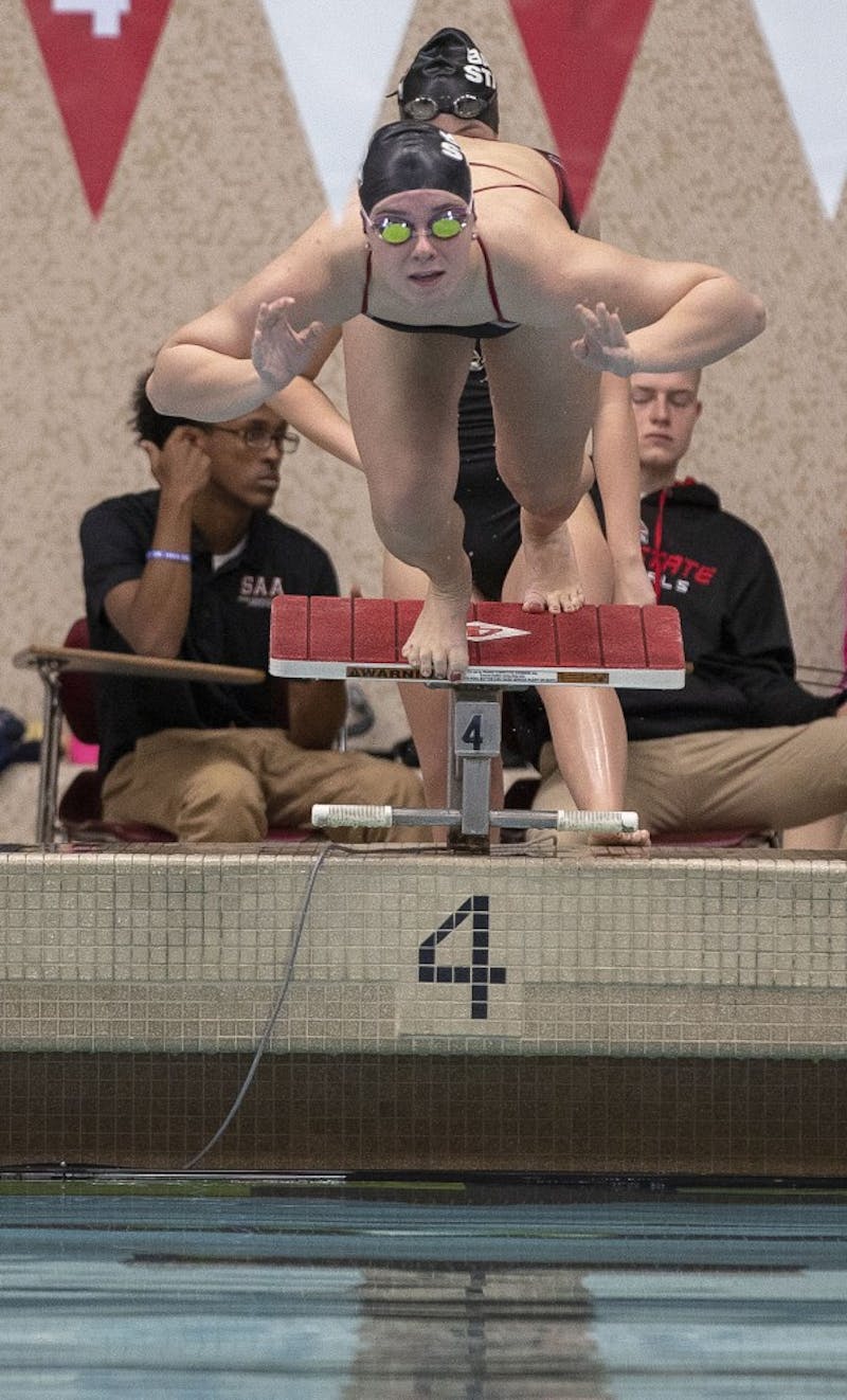 A Ball State swimmer launches off the starting block at the women's swim meet Saturday Nov. 3, at Lewellen Aquatic Center. The Cardinals competed against the University of Akron. Jacob Haberstroh,DN.