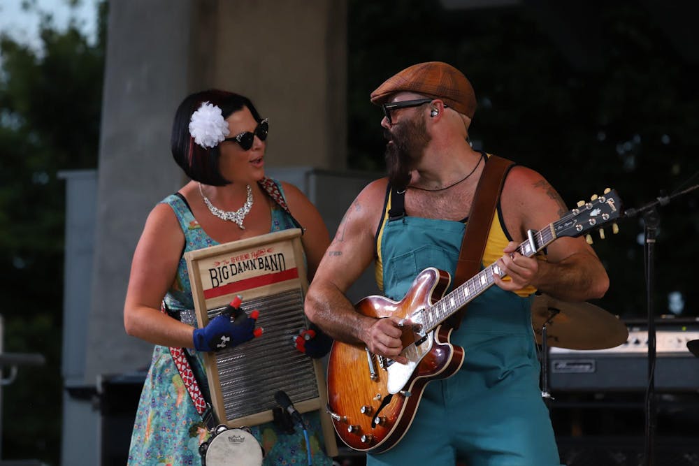 <p>Josh "The Reverend" Peyton and &nbsp;Breezy Peyton perform with their band "The Rev. Peyton's Big Damn Band" July 27 at Canan Commons for the first show of the Three Trails Music Series. Josh and Breezy are married outside of the band. Olivia Ground, DN</p>