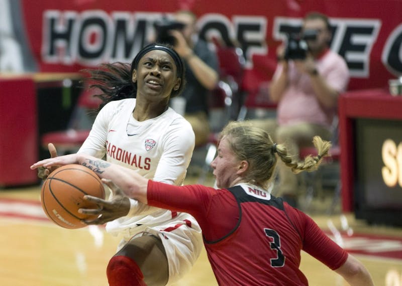 Senior guard Frannie Frazier gets fouled by Northern Illinois’ Gabby Nikitinaite as she goes up for a layup during the Cardinals’ game against the Huskies Jan. 27 in John E. Worthen Arena. Eric Pritchett, DN File