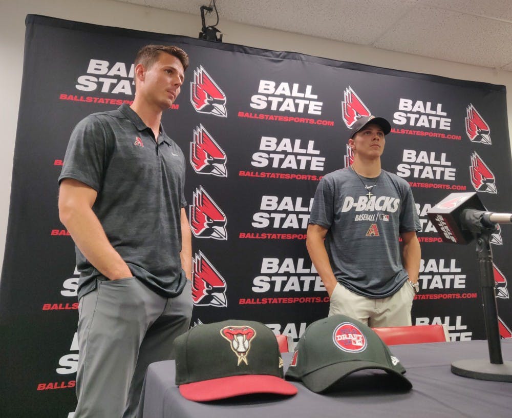 <p>Jeremy Kehrt, Arizona Diamondbacks recruiter, and Drey Jameson, sophomore outfielder and pitcher, converse after a press conference June 7, 2019, at Worthen Arena. Jameson is the eighth first-round draft pick in Ball State Baseball's history. <strong>Rohith Rao, DN</strong></p>