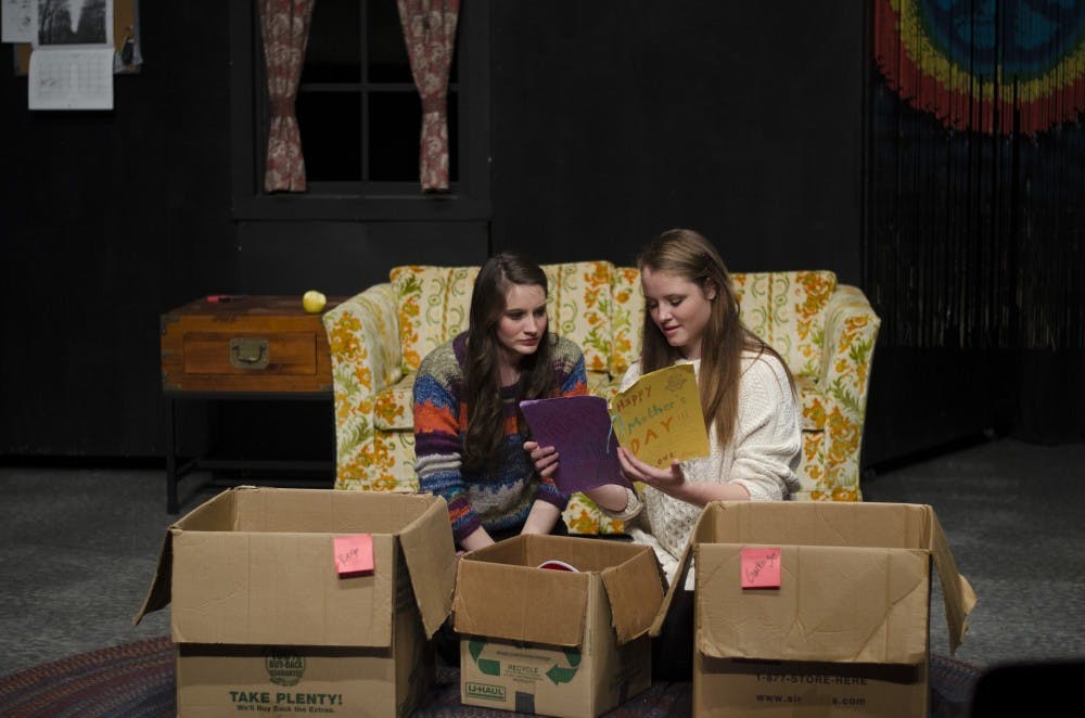 Junior acting major Jessica Ervin, Hope, and senior acting major Emily Lindberg, Fury, look at a Mother