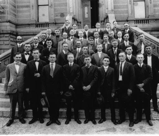 Group of men leaving for World War I service in front of the Delaware County Courthouse Wednesday, May 22, 1918, Muncie Ind. WWI led to the deaths of almost 10 million people, 100,000 being Americans. Ball State University, Photo Provided