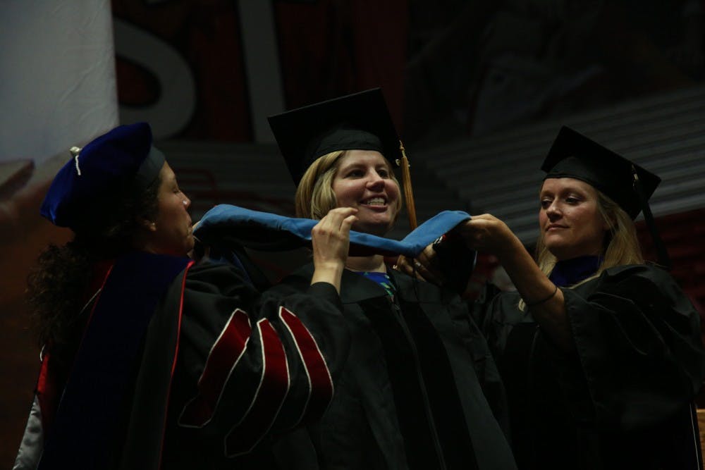 <p>A student receives her doctoral hood at the summer commencement ceremony July 20, 2019, at Worthen Arena. <strong>Rohith Rao, DN</strong></p>