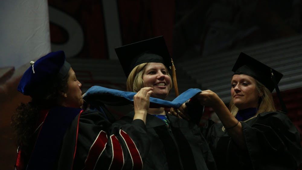 A student receives her doctoral hood at the summer commencement ceremony July 20, 2019, at Worthen Arena. Rohith Rao, DN