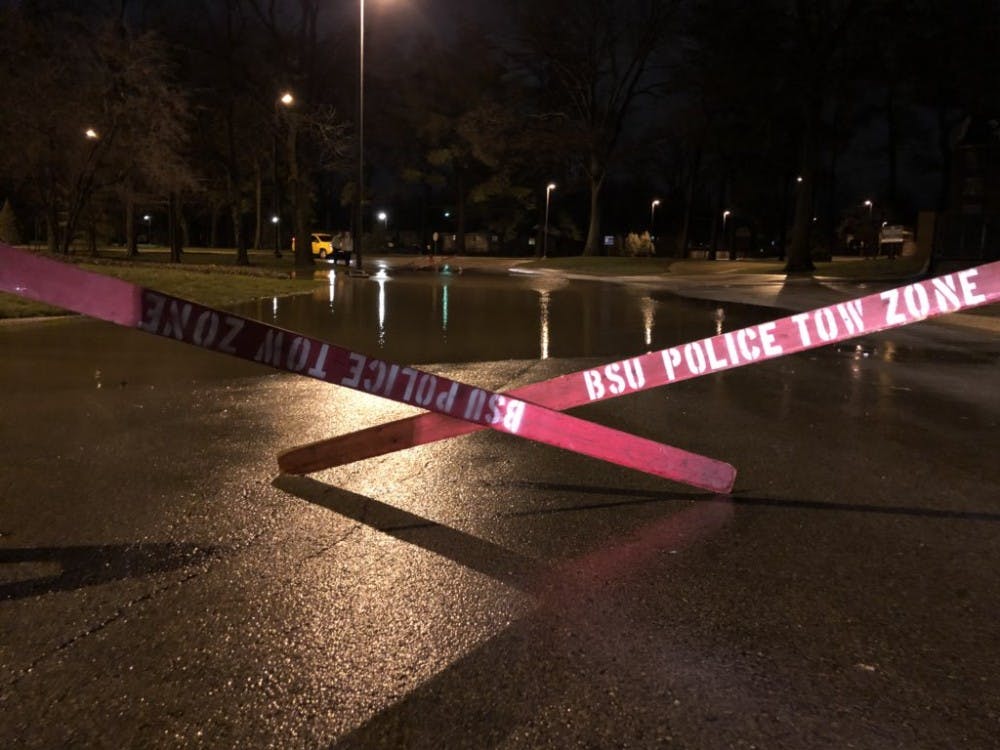 <p>Police barricades and standing water near Kinghorn Hall and the Health Center, on Tuesday, April 3, 2018. <strong>Andrew Smith, DN Photo</strong></p>
