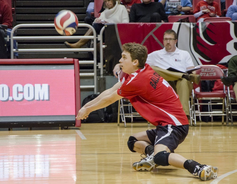 Junior outside attacker Shane Witmer makes the return from Sacred Heart during a volley. DN PHOTO COREY OHLENKAMP 