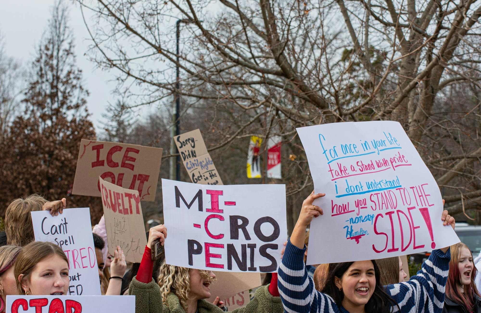 Burris Laboratory School students hold up their signs and chant together as Ball State students walk by Feb. 17 at Ball State University. Aiden Murray, NLI.
