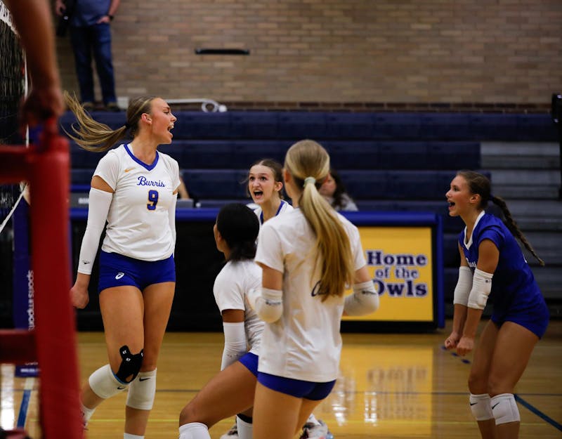 Senior Lilly Howell turns to her team yelling after scoring a point against Noblesville High School Sept. 23 at Ball Gymnasium. Andrew Berger, DN 