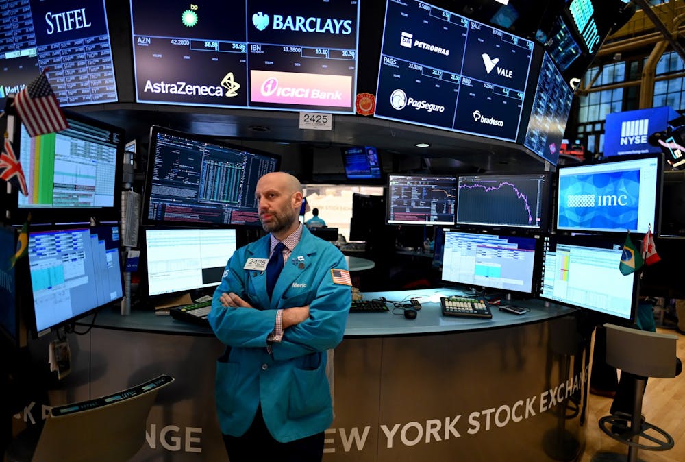 Traders work during the opening bell at the New York Stock Exchange (NYSE) on March 16, 2020 at Wall Street in New York City. (Johannes Eisele/AFP/Getty Images/TNS)
