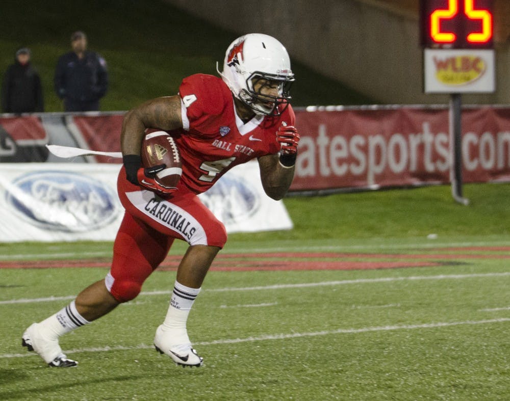Junior running back Horactio Banks runs the ball down the field against Central Michigan on Nov. 6 at Scheumann Stadium. Banks is expected to recover from injury by the end of the summer. DN FILE PHOTO BREANNA DAUGHERTY  