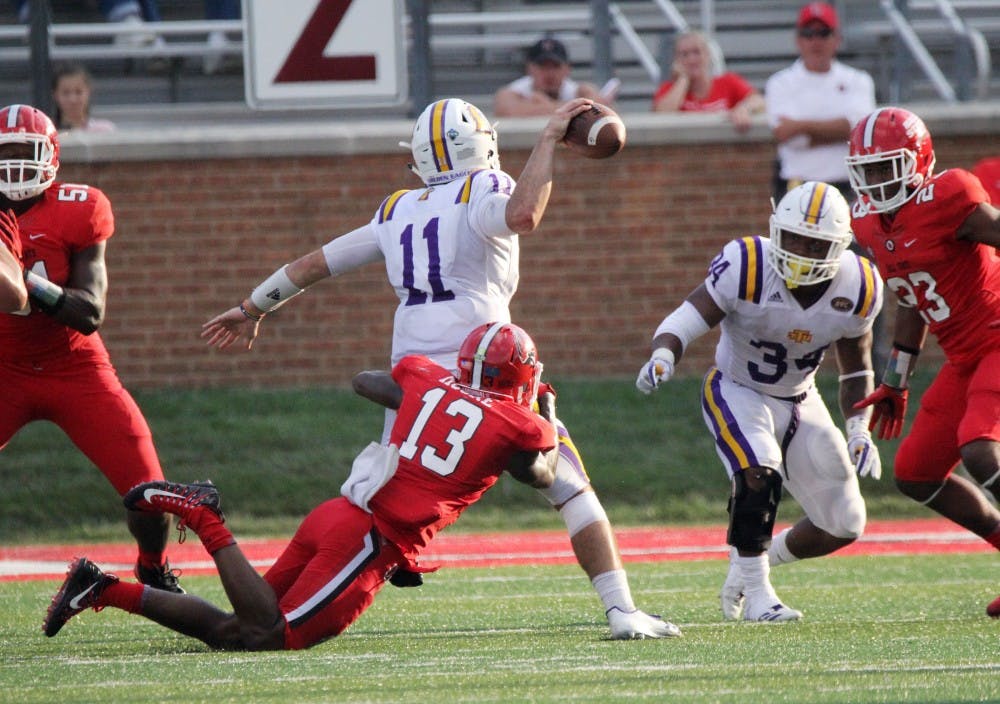 <p>Ball State redshirt senior cornerback David Moore sacks Tennessee Tech’s Andre Sale in the fourth quarter of the Cardinals’ 28-13 win against the Golden Eagles on Sept. 16 at Scheumann Stadium. Moore had three solo tackles. Paige Grider, DN</p>