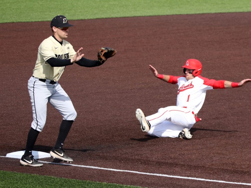 Purdue senior third baseman Nick Evarts calls off junior catcher Bryce Bonner as junior center fielder Aaron Simpson steals third during the Boilermakers' game against Ball State March 19, 2019 at Ball Diamond at First Merchants Ballpark Complex in Muncie, IN. Ball State's 6 to 0 win over Purdue gives them a 11-9 record. Paige Grider, DN