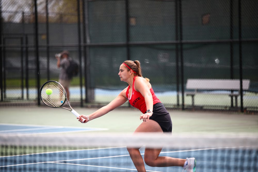 Fourth-year Amy Kaplan volleys the ball in a match against Bowling Green April 14 at the Cardinal Creek Tennis Center. Jacy Bradley, DN