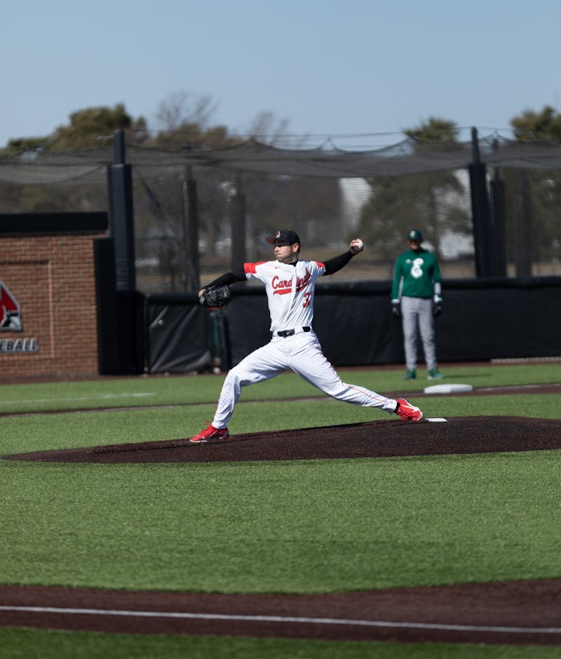 Junior pitcher Tyler Schweitzer pitches the ball in the first game of Ball State's double header against Eastern Michigan Mar. 13 at First Merchants Ballpark Complex. The Cardinals opened their Mid-American Conference season going winning both games against Eastern Michigan with scores of 2-1 and 6-4. Eli Houser, DN