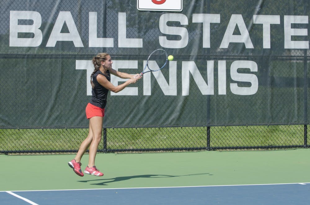 Sophomore Toni Ormond hits the ball during the doubles match against Butler for the Fall Dual on Sept. 20 at the Cardinal Creek Tennis Center. DN PHOTO BREANNA DAUGHERTY 