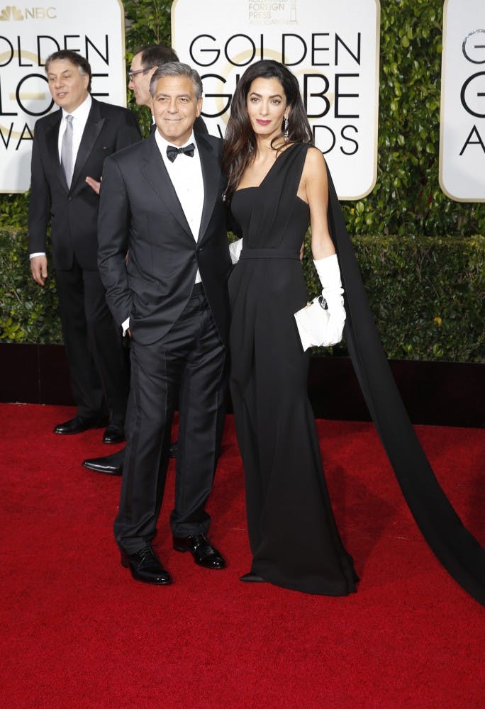 George Clooney and wife Amal arrive at the 72nd Annual Golden Globe Awards show at the Beverly Hilton Hotel in Beverly Hills, Calif., on Sunday, Jan. 11, 2015. (Jay L. Clendenin/Los Angeles Times/TNS)