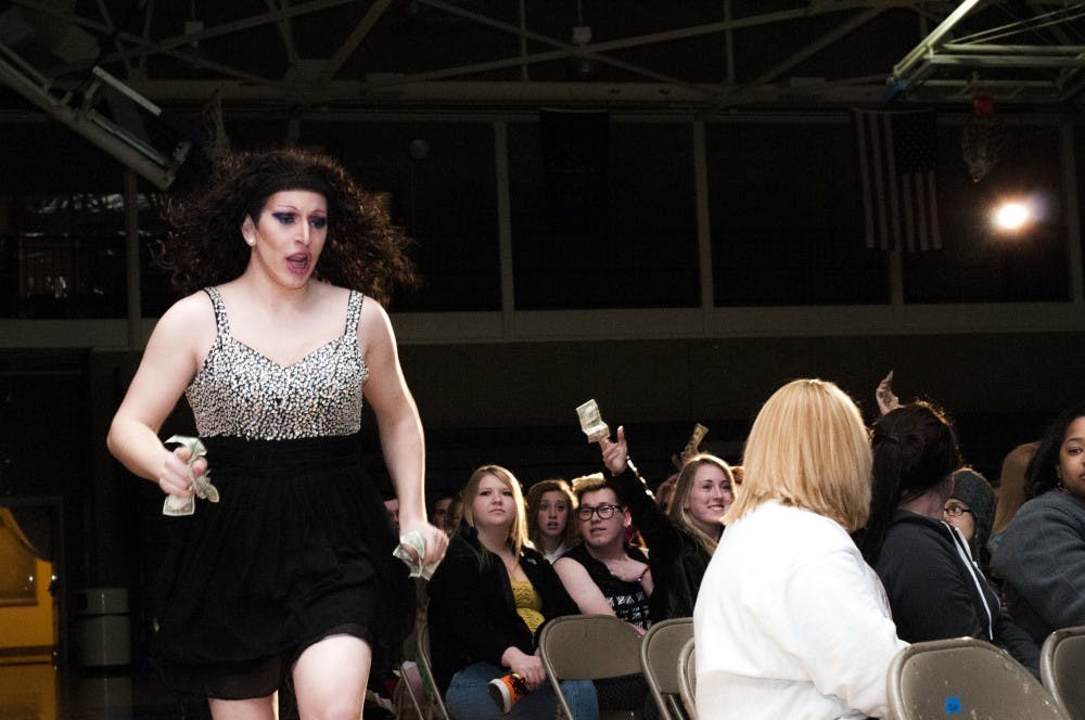 Performer Zsa Zsa La Femme makes her way through the audience back to the stage, tips in hand from attendees, during the Spectrum Drag Show on April 20. Spectrum will host its annual fall Drag Show at 7 p.m. Nov. 2. DN FILE PHOTO JONATHAN MIKSANEK