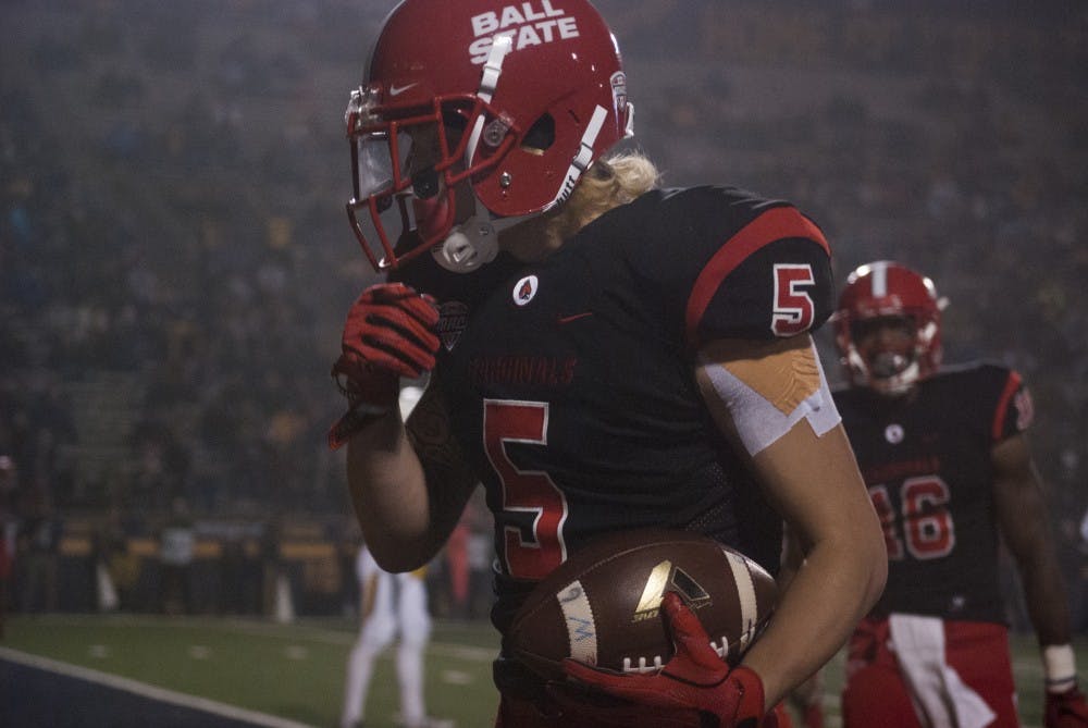 Junior receiver Corey Lacanaria celebrates after scoring a touchdown in Ball State’s 37-19 loss to Toledo at the Gall Bowl Wednesday, Nov. 16. With the loss, the Cardinals were officially eliminated from Bowl contention. Colin Grylls//DN