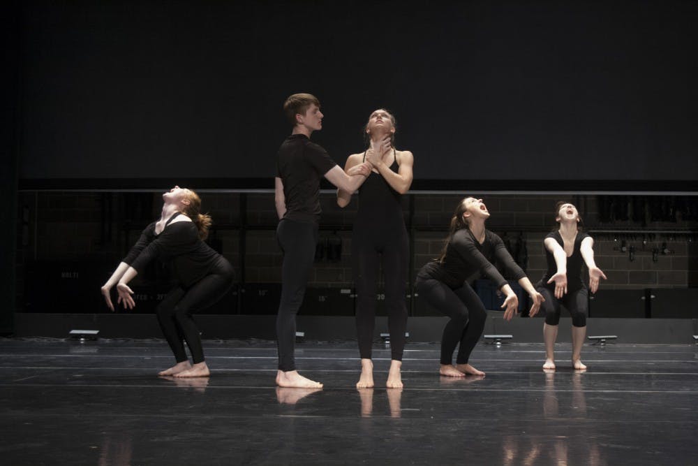 From left, Rachel Wiezorek, Levi Coy, Ciara Borg, Hanna Crane, and Alyssa Washburn pose during thier rehearsal of Dancing Toward Change on April 19 in University Theatre.  Dancing Toward Change is a dance piece that explores the link between cultural beauty standards and acts of violence against the human body. DN PHOTO KAITI SULLIVAN