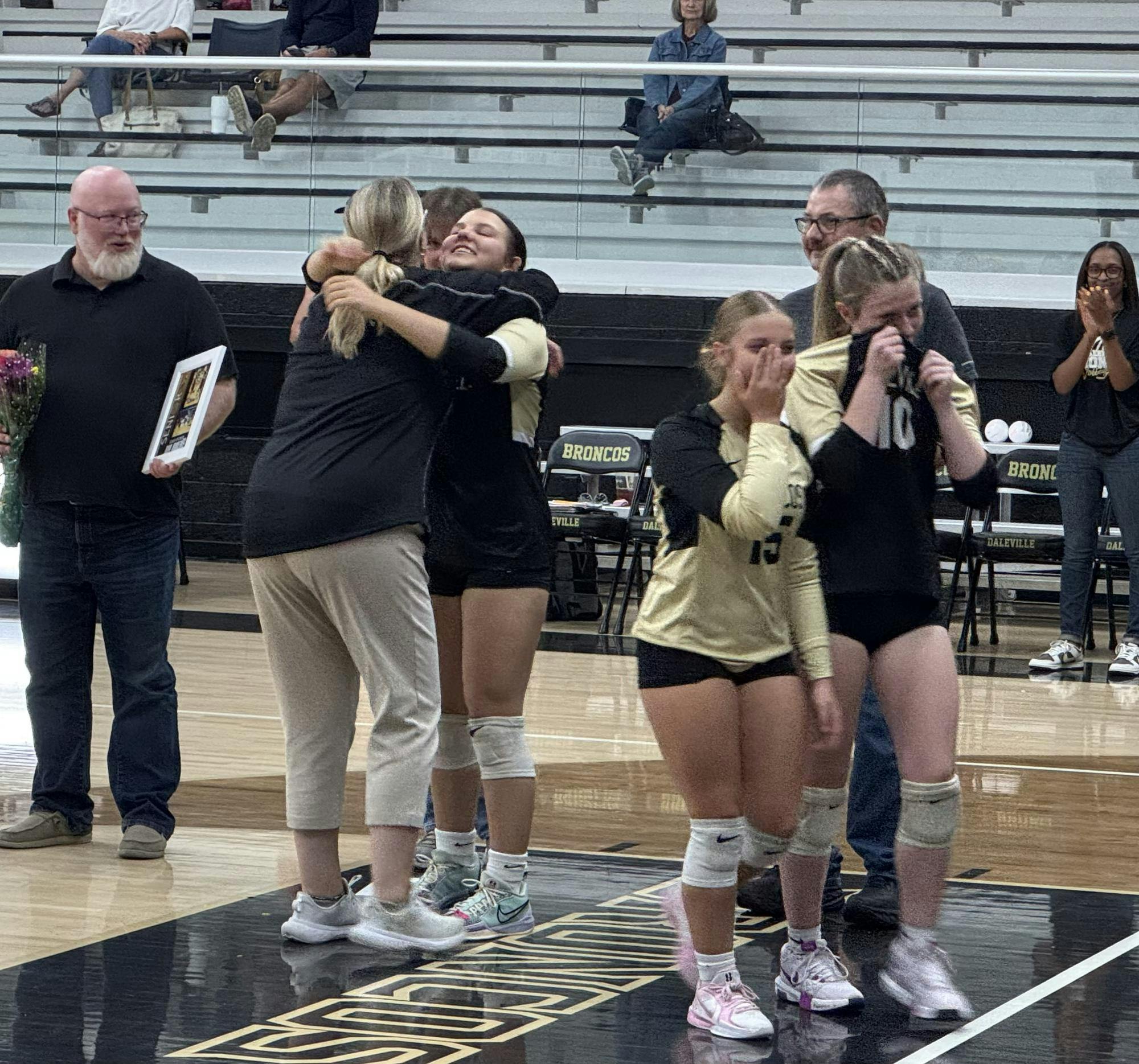 Daleville head coach Gayle Hicks and senior setter Laci Swingley embrace on senior night at Daleville High School on September 24. The Broncos went on to defeat conference rival Shenandoah 3-0.
