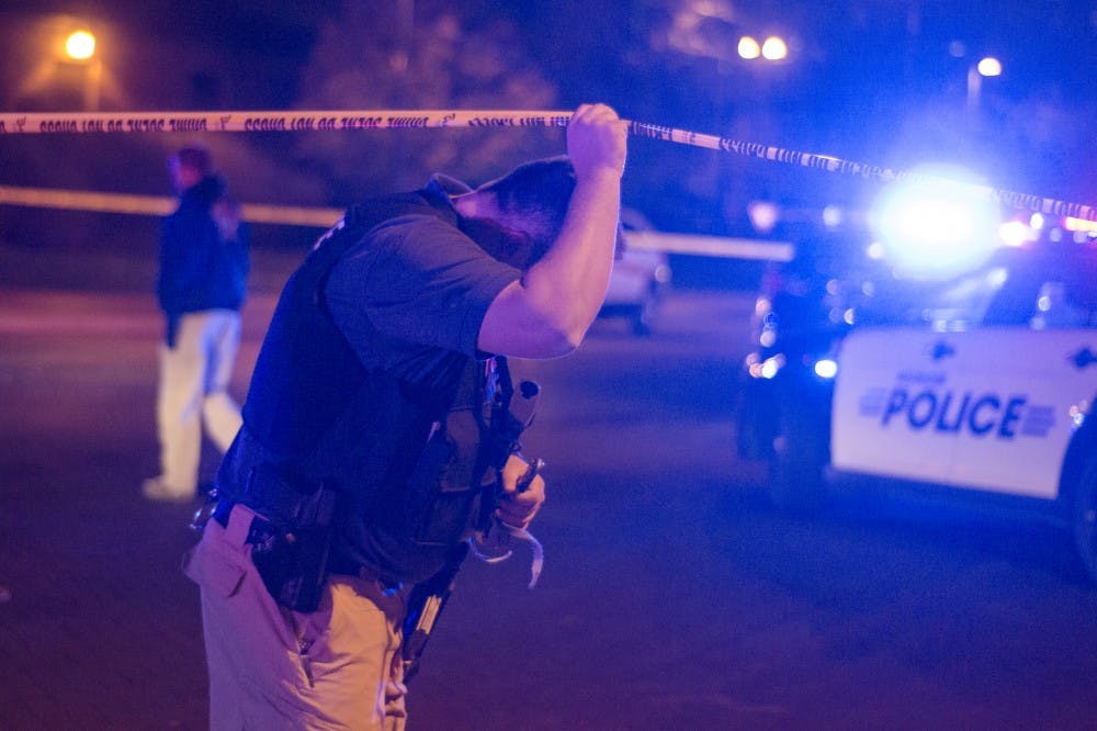 Police secure the Student Recreation and Wellness Center after a report of an armed assailant in the building. DN PHOTO COREY OHLENKAMP