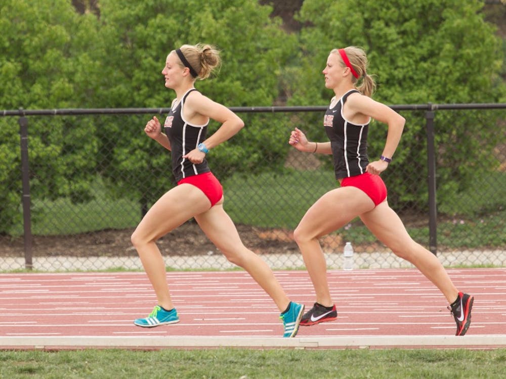 Sisters Caitlynn and Courtney Edon run on the track on April 14, 2012, at Ball State. PHOTO PROVIDED BY BALL STATE PHOTO SERVICES