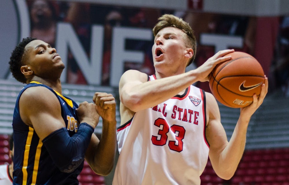 Junior guard Ryan Weber tightly guarded by a Toledo Rocket defender on Jan. 6 in Worthen Arena. DN PHOTO BY BREANNA DAUGHERTY