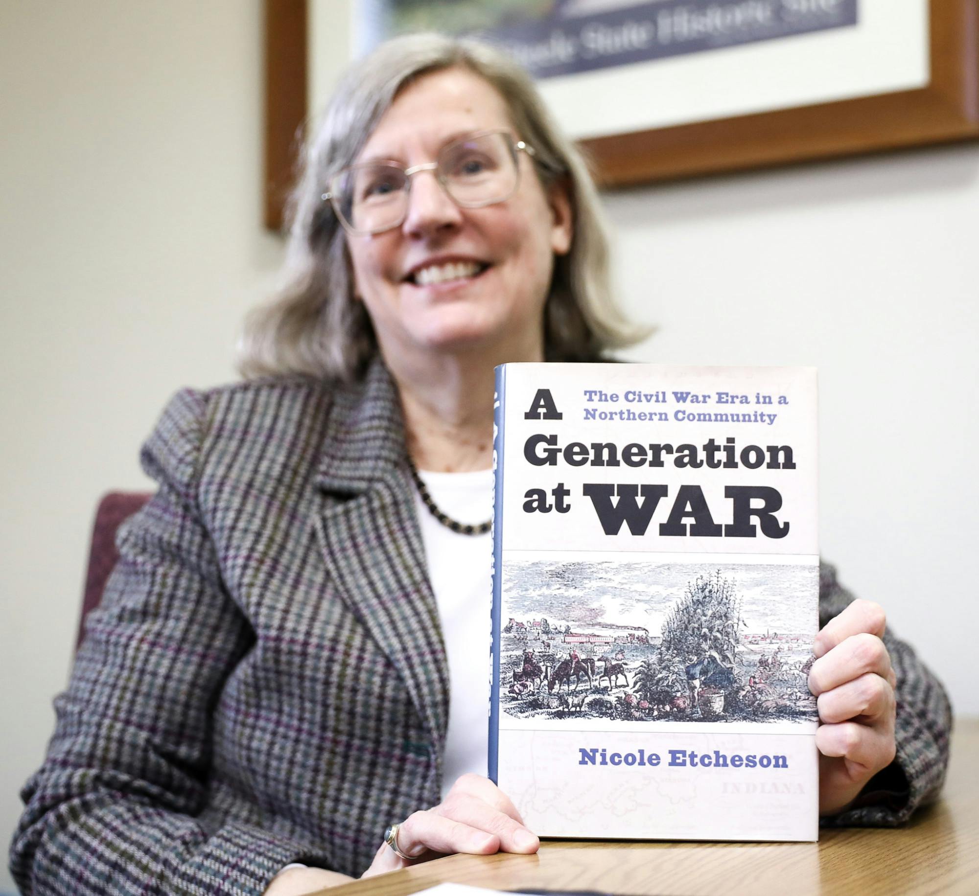 Ball State professor and author Nicole Etcheson holds a copy of the novel “A Generation at War: The Civil War Era” April 1 at the Richard W. Burkhardt Building. The book covers the lasting effects of the U.S. Civil War on life in Putnam County, Indiana. Andrew Berger, DN 
