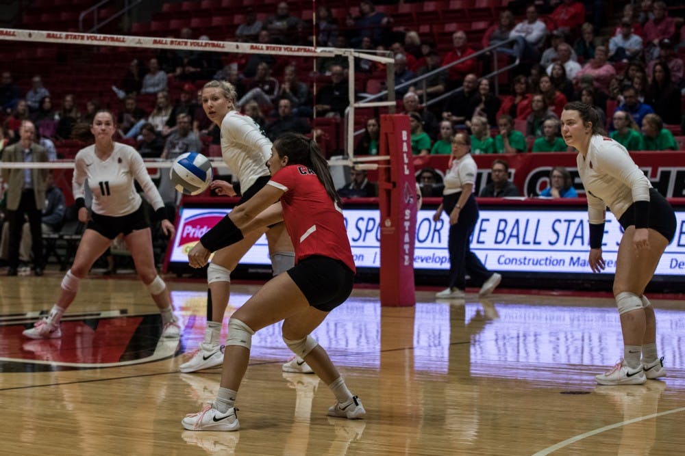 Everyone in John E. Worthen Arena looks on Kate Avila Oct. 12, 2018, as she attempts to return a ball served by Ohio University in the fourth set of the game. The Cardinals couldn’t close out the third set, but brought it back in the fourth to defeat the Bobcats. Eric Pritchett,DN