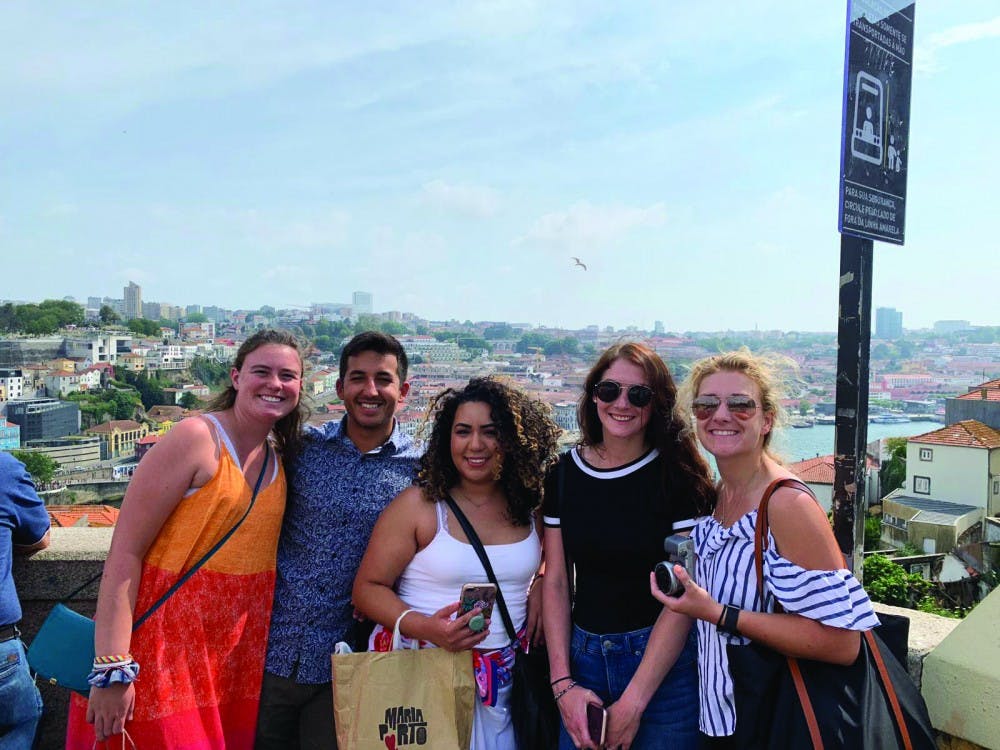 Meghan Pier, Scott Barrera, Marlenne Devia, Ashley Schoener and Katie Califano explore downtown Porto in July 2019. Stephanie Simon-Dack, who co-led the study abroad program, said staying in one area in Portugal rather than constantly moving from city to city allowed her students to live like Porto’s residents and connect more with Portuguese culture. Meghan Pier, Photo Provided. 