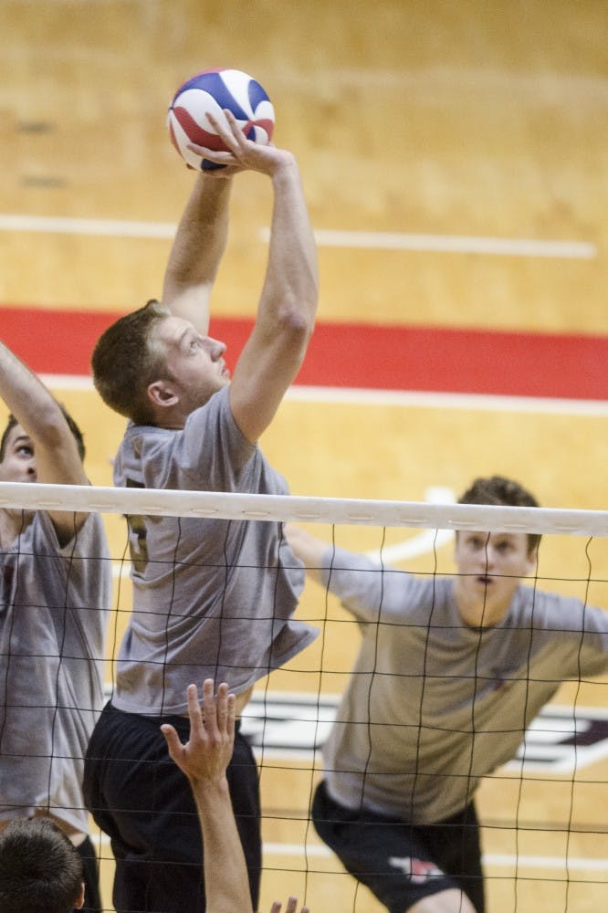Senior setter Graham McIlvaine sets up the ball for his teammate on Nov. 10 against Loyola. With a number of seniors on the team, the men