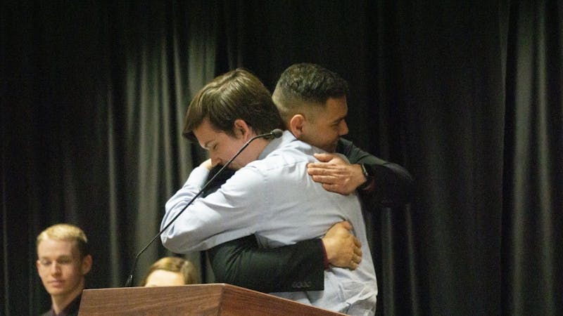 Former Student Government Association President Isaac Mitchell congratulates newly inaugurated President Aiden Medellin. Elevate was inaugurated April 17, 2019, at the L.A. Pittenger Student Center. John Lynch, DN