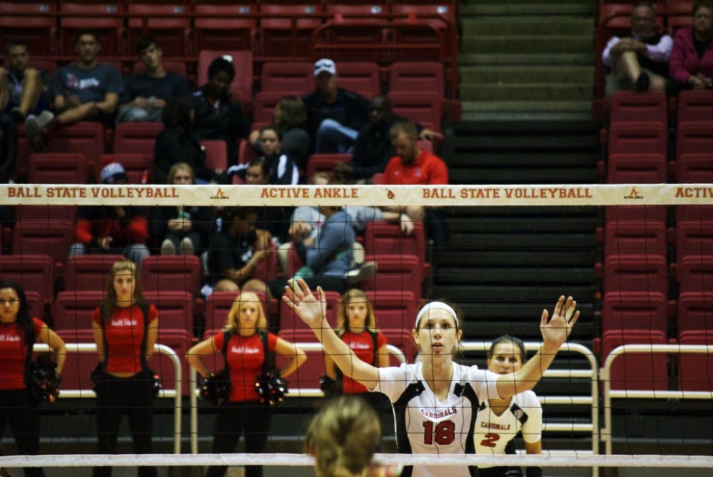 At the Oct. 3 home volleyball game against Eastern Michigan, senior middle hitter Hayley Benson stands prepared to block the ball. DN PHOTO SAMANTHA BRAMMER